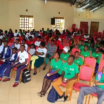 Young people seated in a hall during a forum